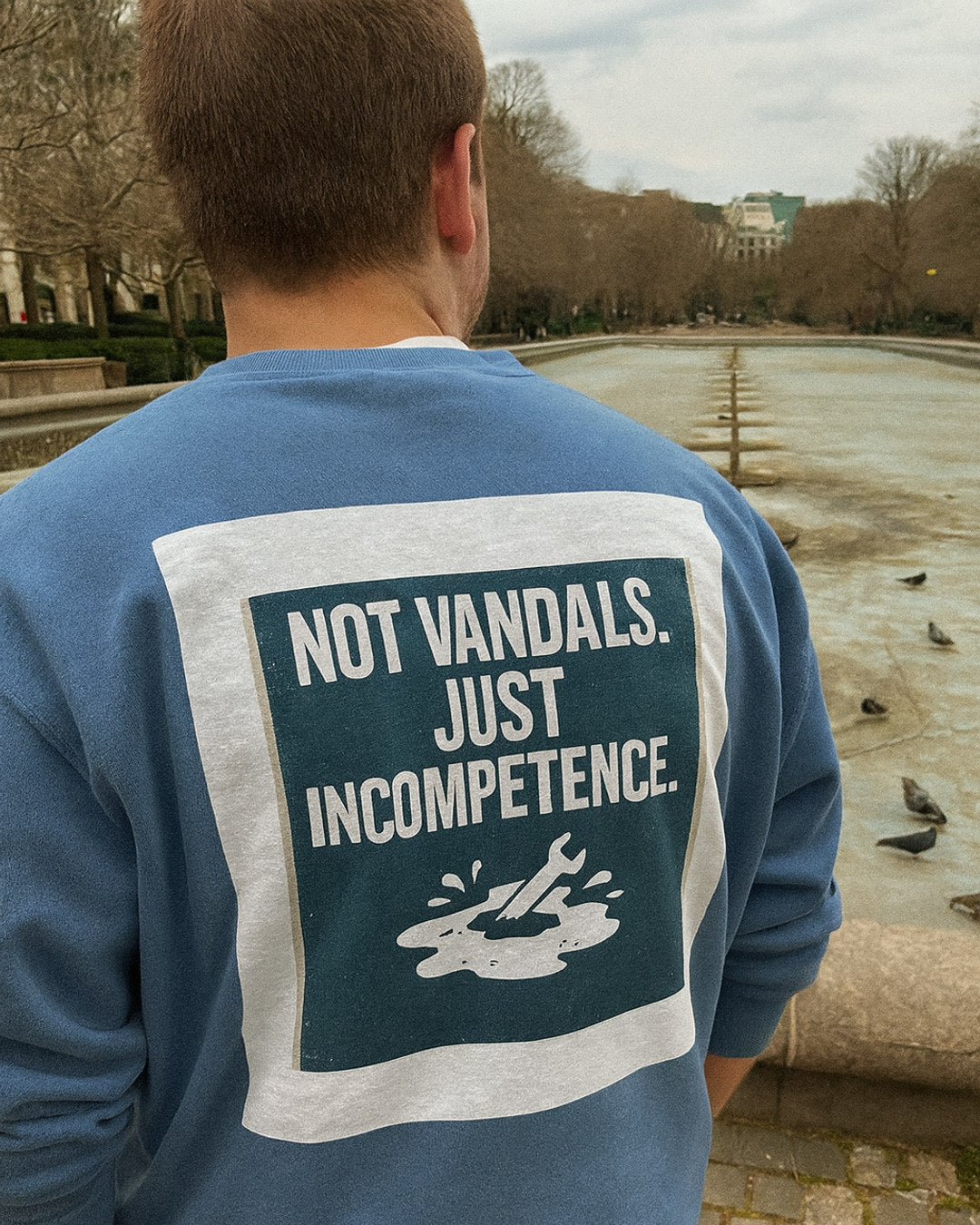 "Not Vandals. Just Incompetence." Tee — worn in the wild