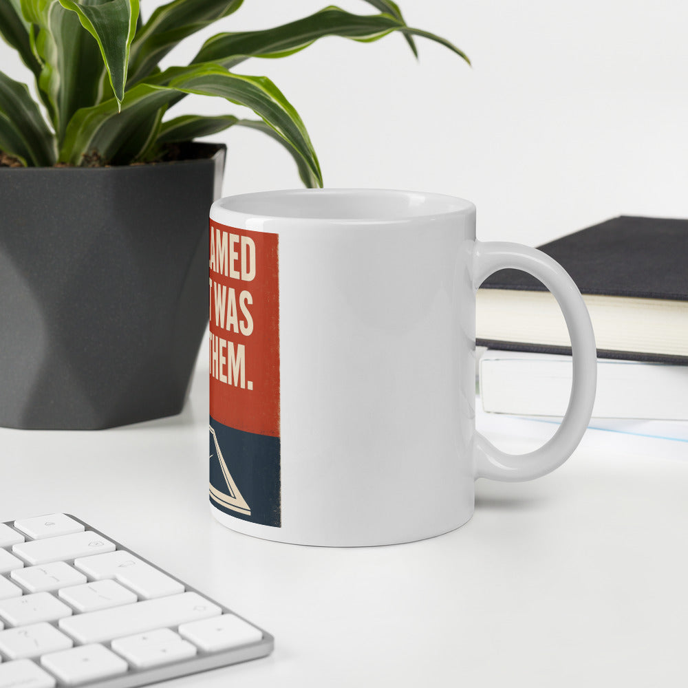 "They Blamed Us. It Was Them." Mug — political satire mug mockup — view 6